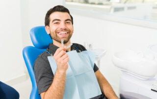 Close up of a happy man using invisible orthodontics