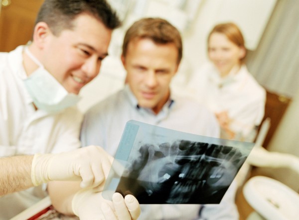 Dentist explaining x-ray to patient